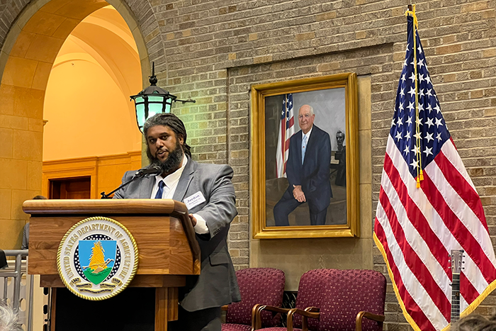 an image of Jordan Berg-Powers speaking at the U.S. Department of Agriculture’s (USDA) Jewish American Heritage Month event celebrating Jewish contributions to agriculture and the fight against hunger in Americ