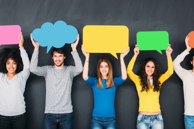 people holding conversation signs