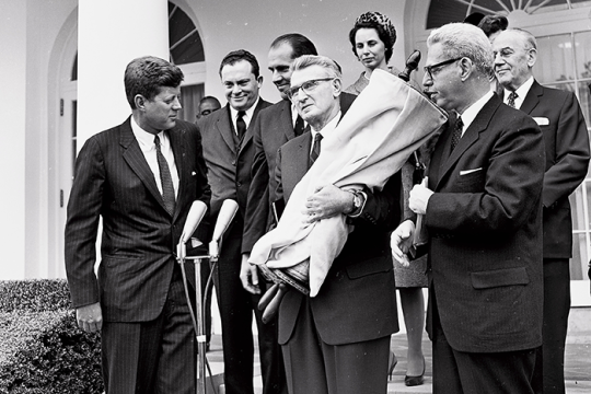 The founders of the Religious Action Center of Reform Judaism (the RAC) stood in the White House Garden and presented President John F. Kennedy with a historic Torah from the Isaac Mayer Wise Temple in Cincinnati, Ohio.