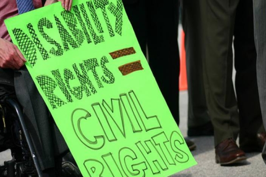 Handwritten sign reading DISABILITY RIGHTS ARE CIVIL RIGHTS