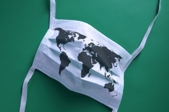 Face mask with a map of the world printed on it